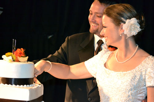 Couple cuts wedding cake